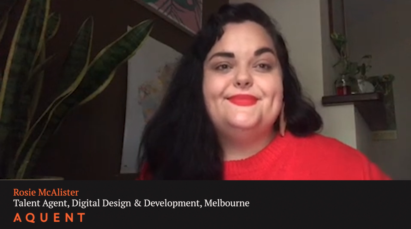 Smiling woman in a red sweater speaking on a video call; lower third shows the name Rosie McAlister and title Talent Agent, Digital Design & Development, Melbourne (AQUENT).
